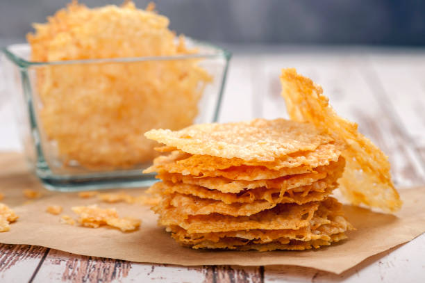 Parmesan chips. Appetizer for a gluten-free and ketogenic diet. Close up and horizontal orientation. \