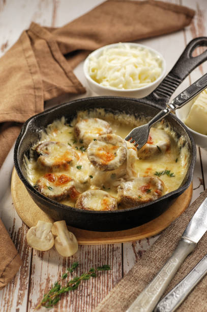 istock Mushrooms baked with cheese in a pan. 1204622203