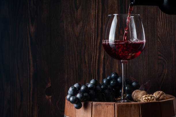 old red wine. traditional production and storage of wine. - wine cellar wine bottle grape imagens e fotografias de stock