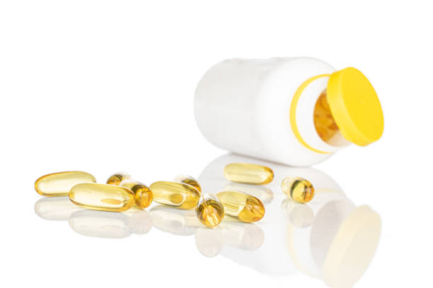 istock Golden fish oil isolated on white 1204624257