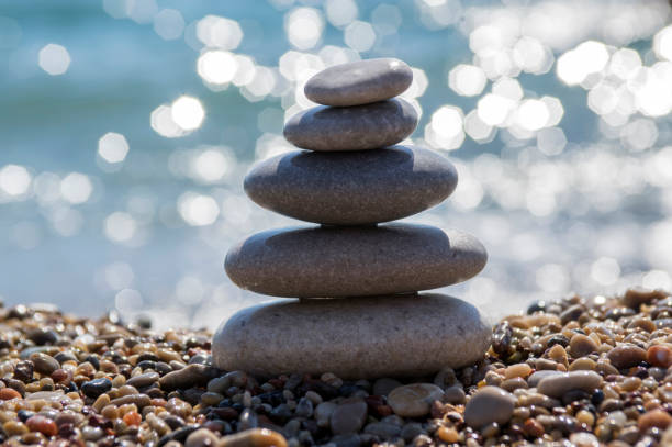 istock Stones and pebbles stack, harmony and balance, one stone cairn on seacoast 1204624449