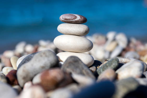 istock Stones and pebbles stack, harmony and balance, one stone cairn on seacoast 1204624489