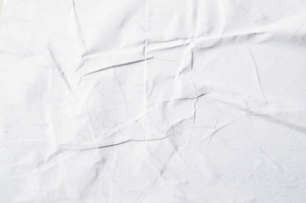 istock Creative background with scattered overlay of crumpled papers. 1204624750