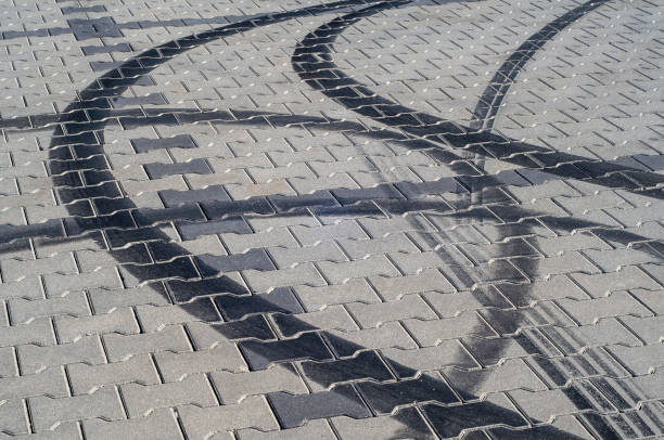 istock Black tire tracks on the pavement after drifting 1204624783