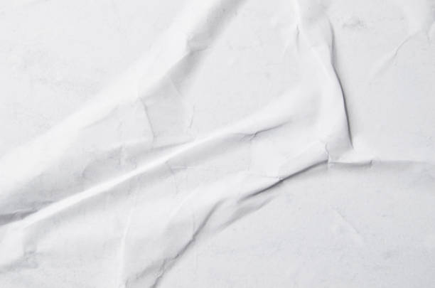 istock Creative background with scattered overlay of crumpled papers. 1204625058