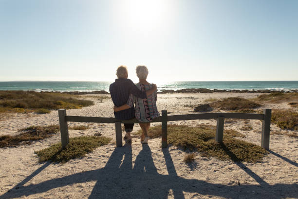 istock Old couple in love at the beach 1204626379