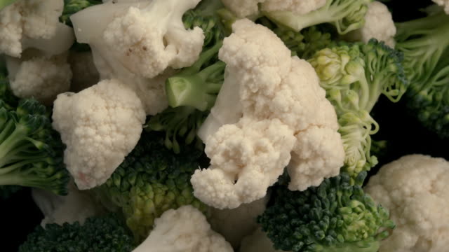 broccoli and cauliflower slices in the air