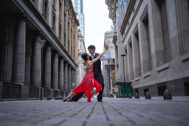 istock Young tango dancing couple performing on the street 1204626568