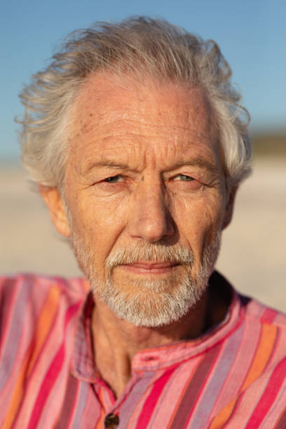 istock Old man relaxing at the beach 1204628003