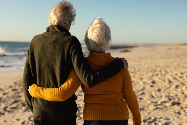 istock Old couple in love at the beach 1204628164