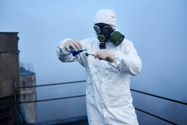 istock Worker scientist wearing protective coverall and gas mask doing ecological tests on the roof 1204628326