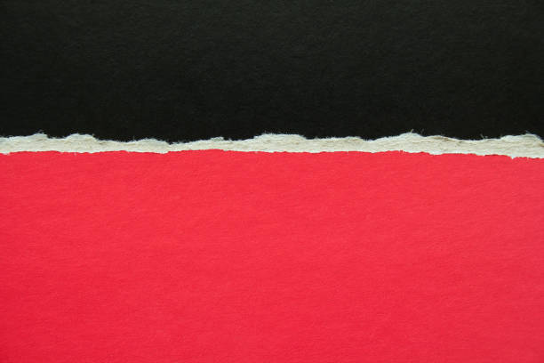 istock Red and black torn sheet of cardboard paper texture background. Can be used for text message. 1204628626