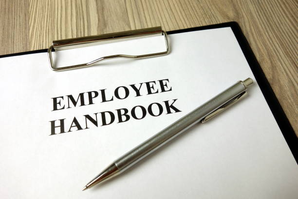 istock Employee handbook with pen on desk 1204628652
