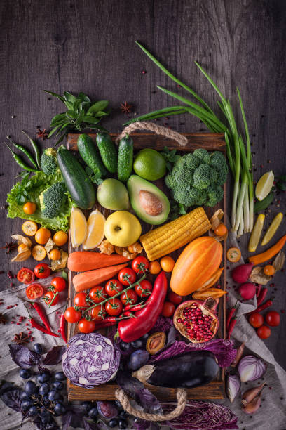 istock Fruits and vegetables lie on a wooden table 1204628784
