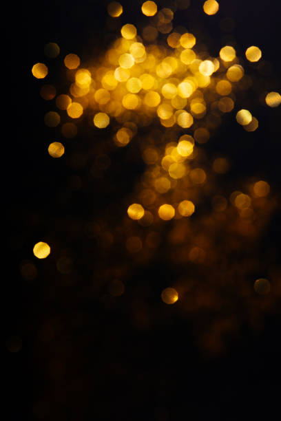 istock Beautiful blurred golden background on black 1204630797