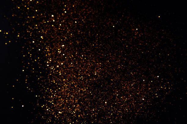 istock Beautiful blurred golden background on black 1204630802