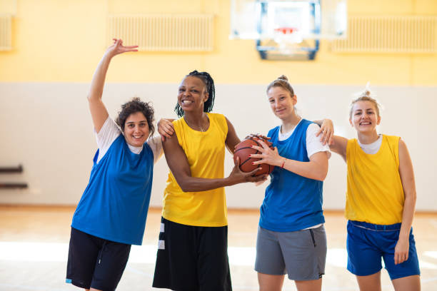 istock Multi-ethnic female basketball team in good mood on training 1204633814