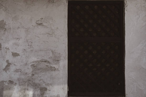 istock Door of an old abandoned building texture background 1204634277