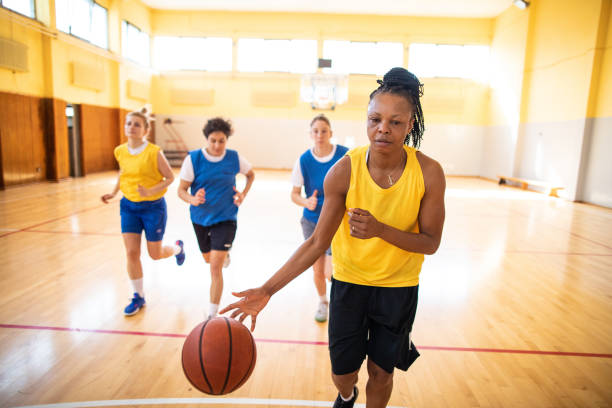 istock Female basketball team playing friendly match on training 1204634287