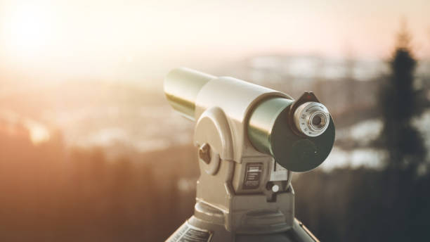 istock Future and inspiration concept: Tourist binocular, landscape in blurry background. Wintertime 1204634892