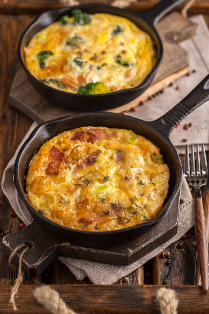 istock Home cooked frittata on a wooden table. 1204634898