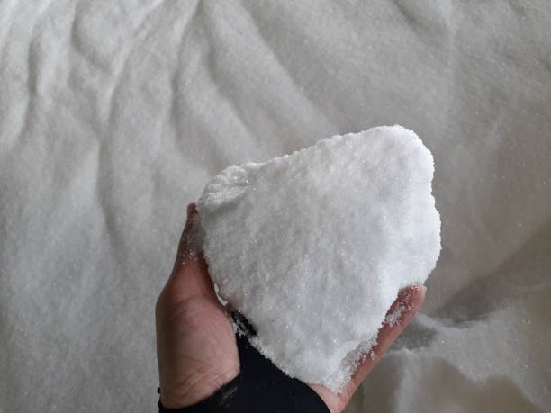 istock chemical fertilizer and hand 1204634954