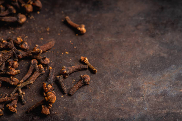 istock Dry cloves spices on the dark rustic background 1204637124
