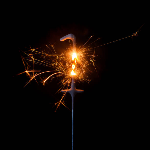 istock Burning sparkler in shape of number one 1204637130