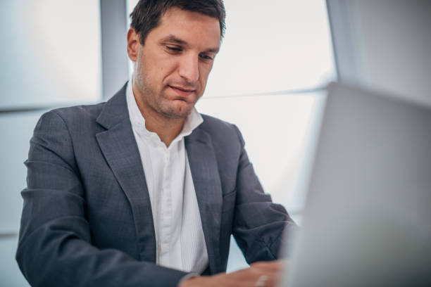 istock One handsome man working on the laptop 1204637727