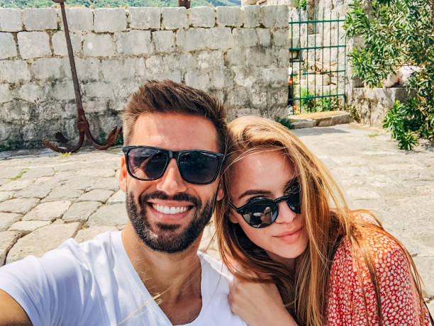 istock Young couple making selfie on vacation 1204639580