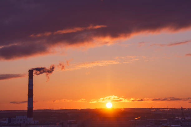 istock Pipe emissions into the atmosphere on the evening sunset horizon. 1204640022