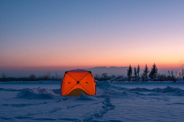 istock Tent camping in the snow in winter 1204640076