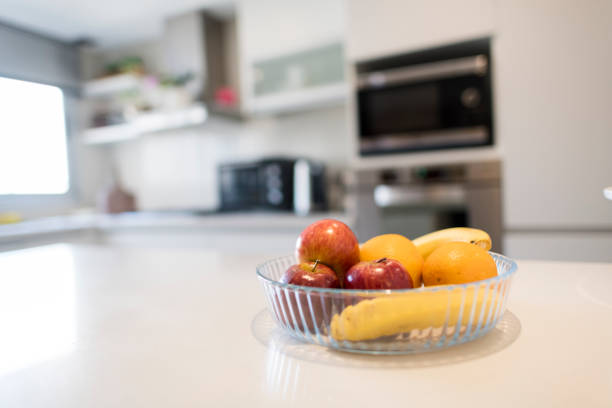 istock Close up of fruit bowl on a clean kitchen counter 1204640889