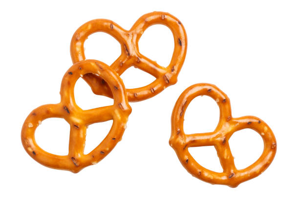 salty pretzels on white - pretzel imagens e fotografias de stock