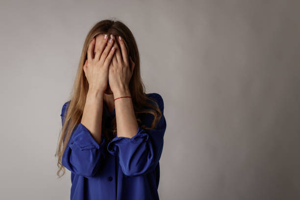 istock Sad young woman in blue. 1204641508