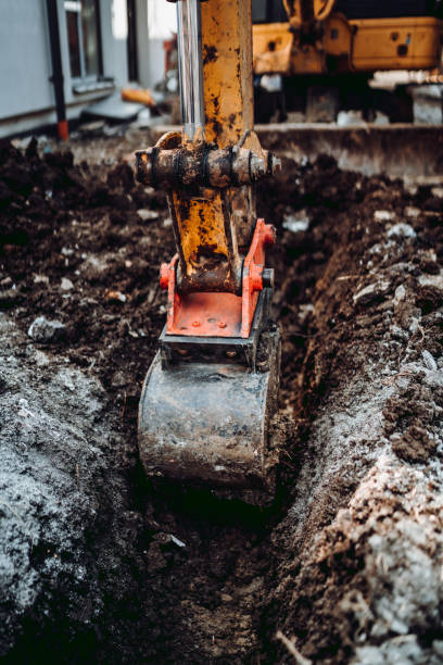 istock Details of excavator scoop digging on construction site 1204642768