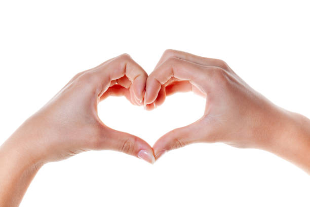 istock Woman hand making a heart shape. isolated on white 1204643710