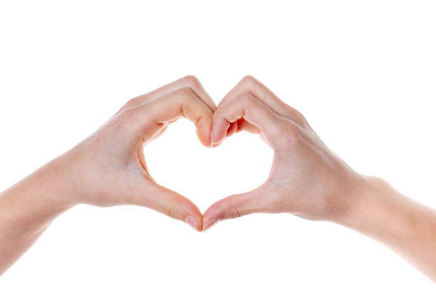 istock Woman hand making a heart shape. isolated on white 1204643786