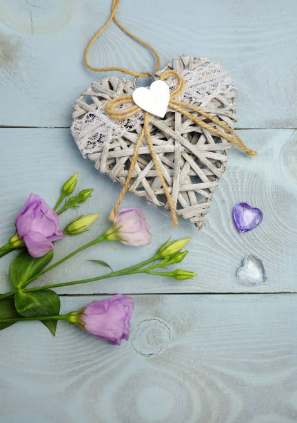 istock Wicker heart, glass hearts and eustoma 1204644734