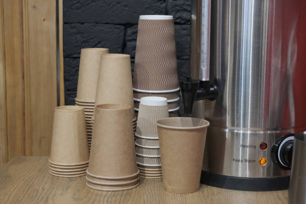 istock Water Dispenser and Paper Cup for Drinking Water in Office 1204647144