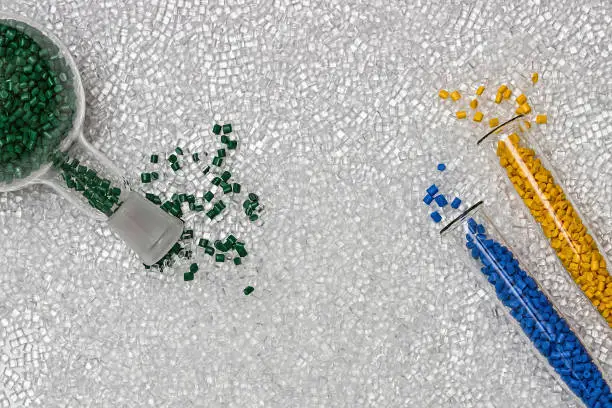 Photo of Plastic granules. Polymer pellets. Polymeric dye. Colorant pellets.