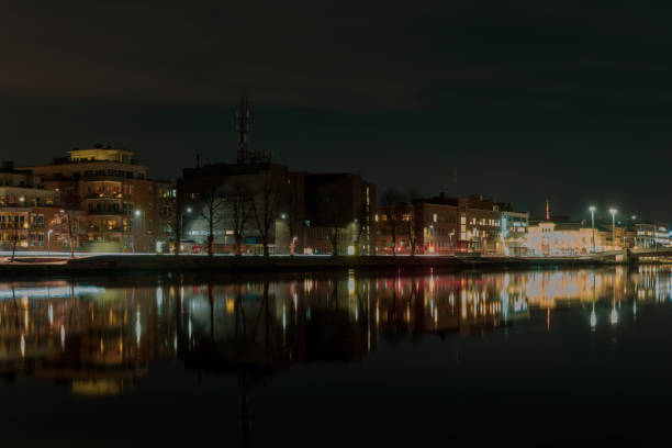 Drammenselva River flowing through Drammen at night in winter evening