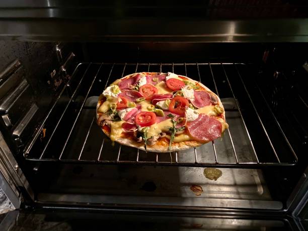istock Homemade pizza baked in the oven 1204651366