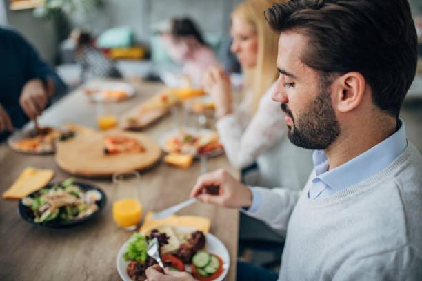 istock Family having lunch together at home 1204651576