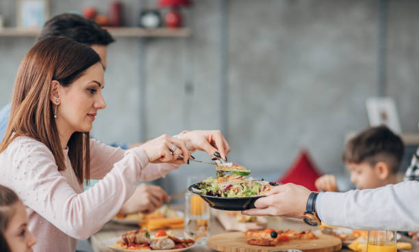 istock Family having lunch together at home 1204651606