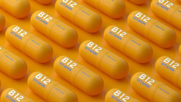 B12 Vitamin Pills over Background B12 Vitamin Pills over Background number 12 photos stock pictures, royalty-free photos & images