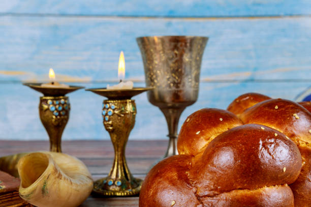 istock Shalom shabbat eve candles with challah and wine 1204659102