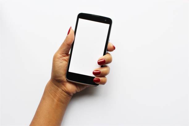 Women hand red nail polish showing smartphone photo stock photo