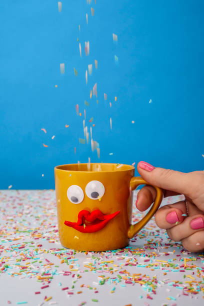 istock Coffee cup with happy face and sprinkles 1204662213