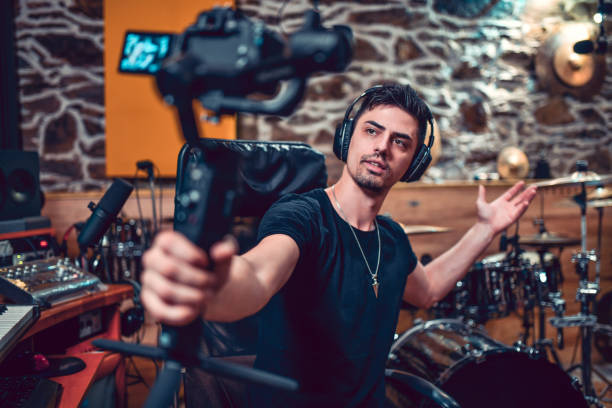 Male Producer Making A Vlog About His New Studio